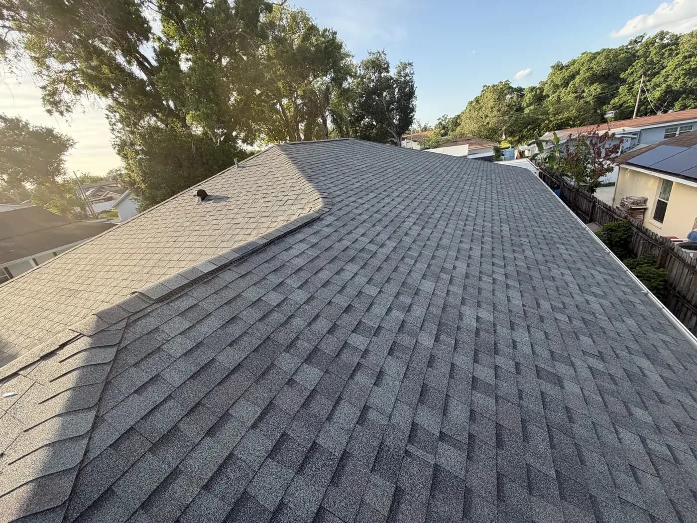 Completed grey architectural shingle roof on a Tampa home